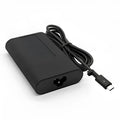 Black 65W USB-C laptop power adapter with a set of international plug cords including UK, US, EU, AU, and ZA types.