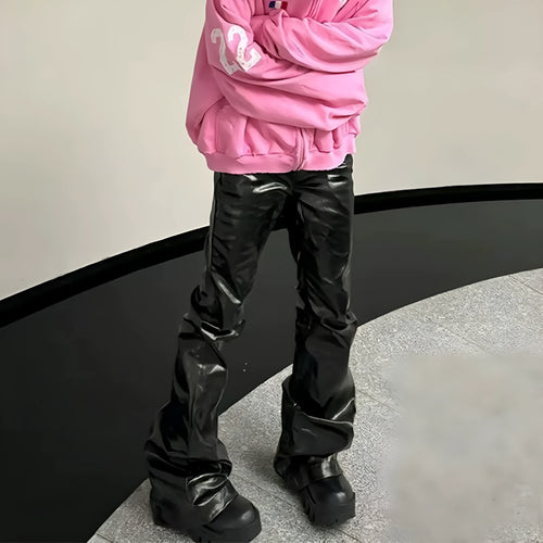 A pair of black skinny jeans with a high-shine patent leather finish and straight leg cut.