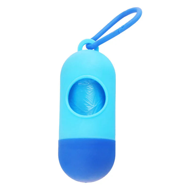 Small, lightweight dog poop bag holder showing side hook and Velcro strap for attachment.