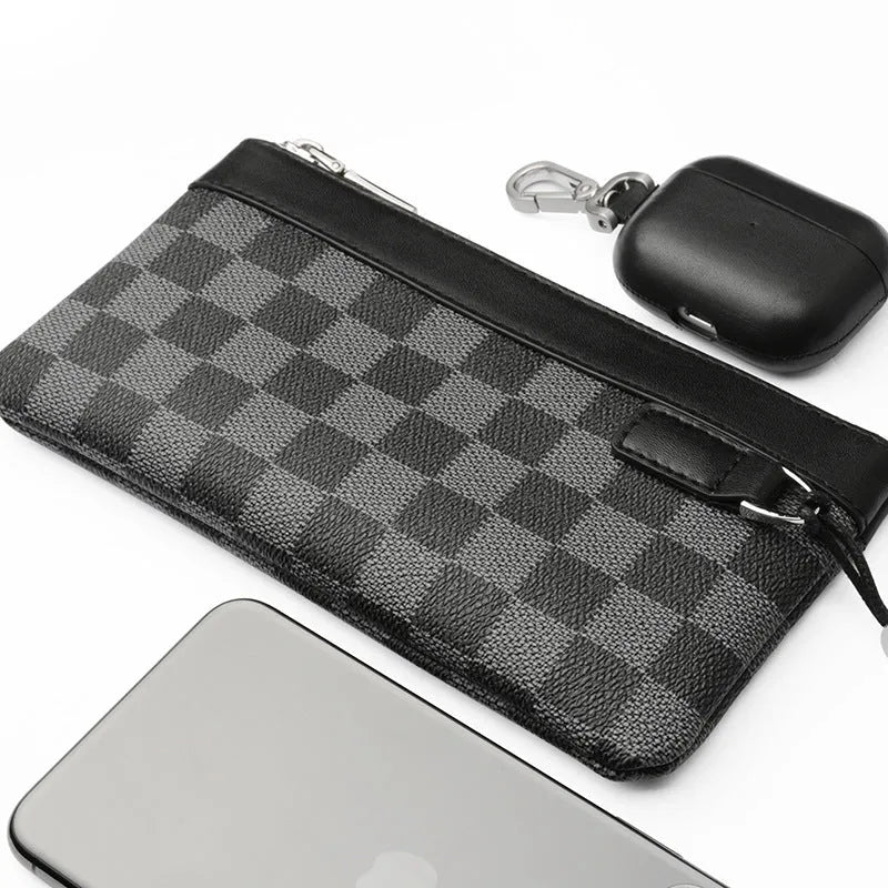 Black plaid textured men's leather clutch wallet showing front view.