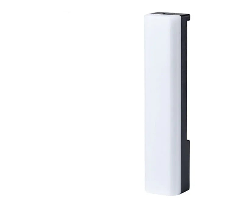 A tall, colourful RGB table lamp with a white or black shell reacting to sound on a desk.