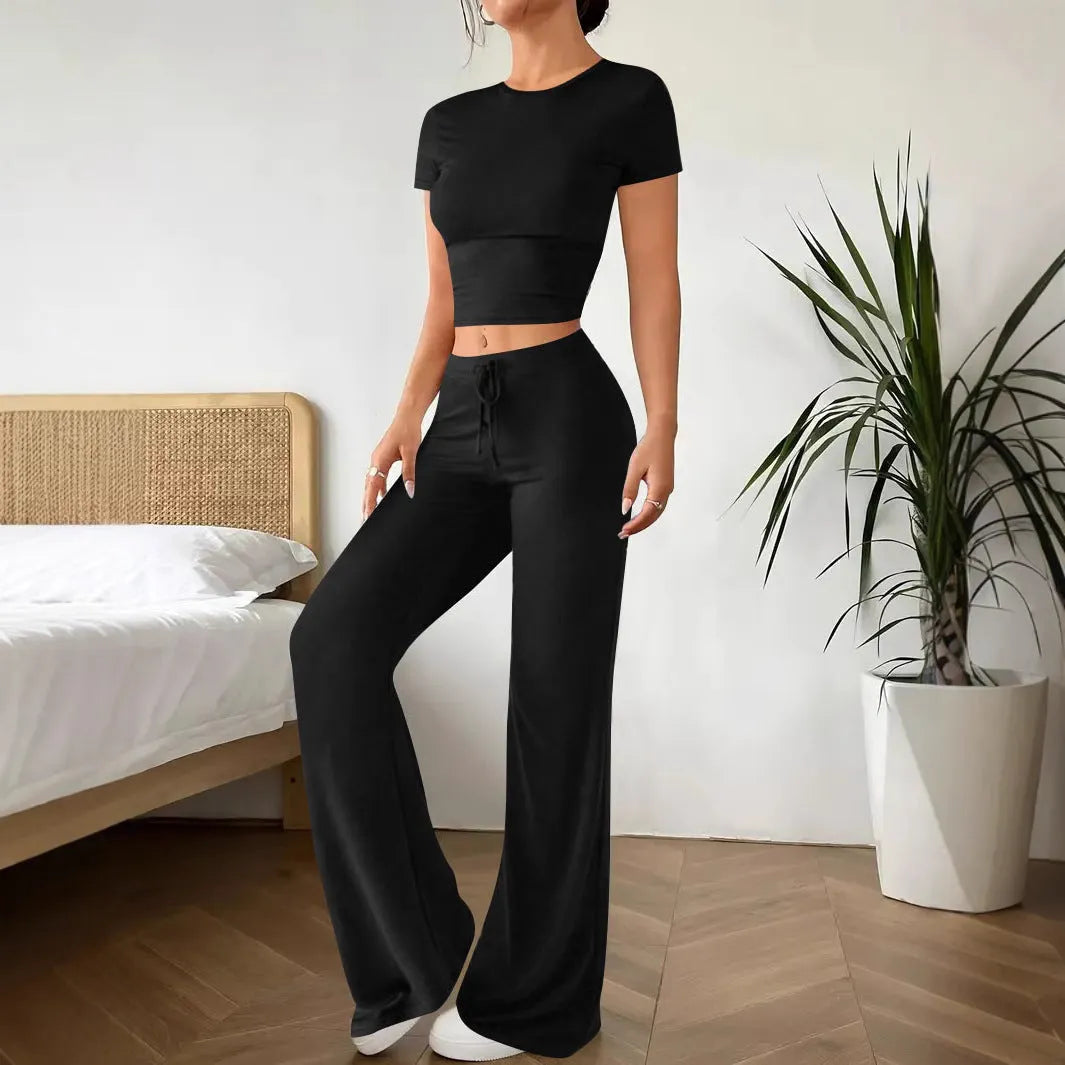 Black high-waisted trousers and short sleeve T-shirt co-ordinated suit for women.