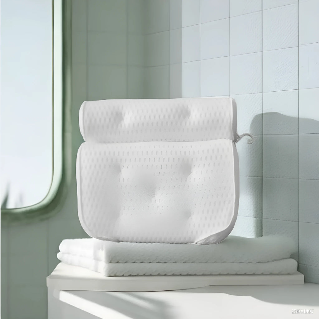 White adult bathtub pillow with 4D mesh material and suction cups on a bath mat.