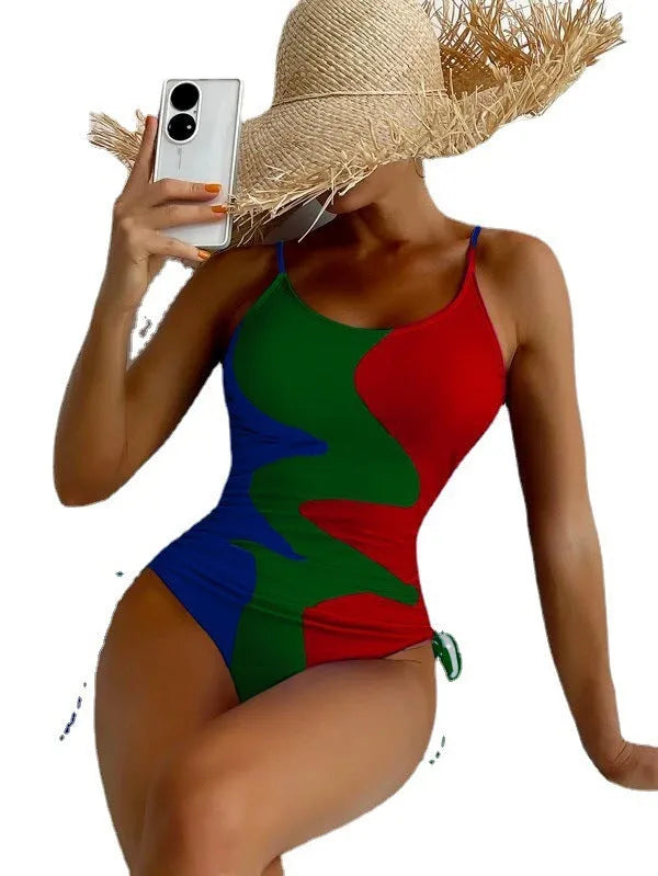 Women's blue sleeveless one-piece swimsuit with fixed trunks and backless design for swimming sports