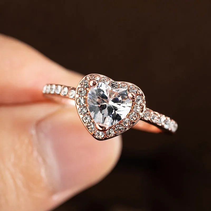 Women's heart-shaped wedding ring with crystal accents in rose gold or silvery finish