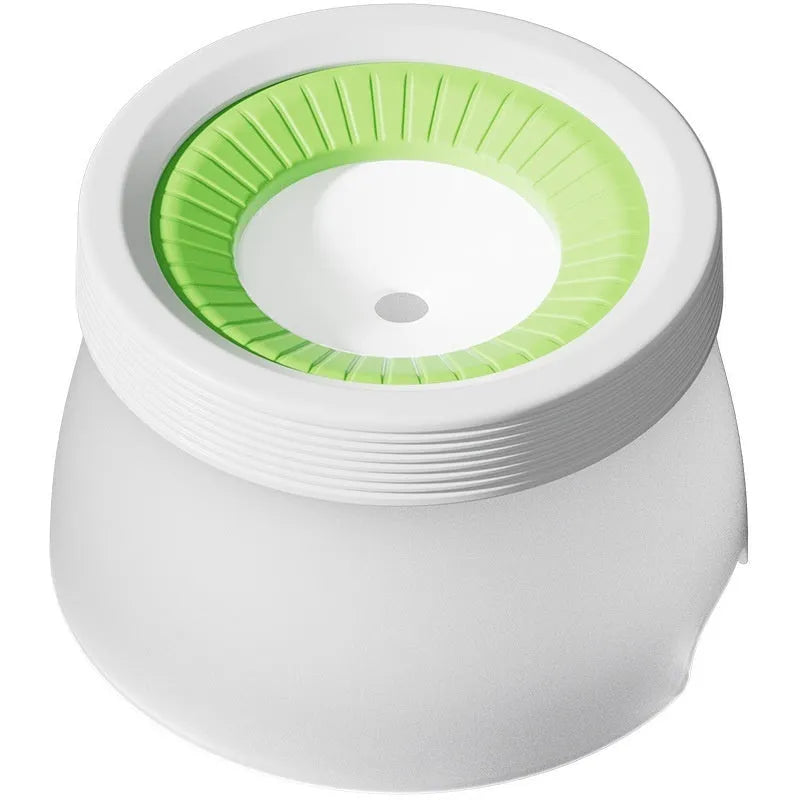 Green pet suspension water bowl for dogs and cats on a matching plate.