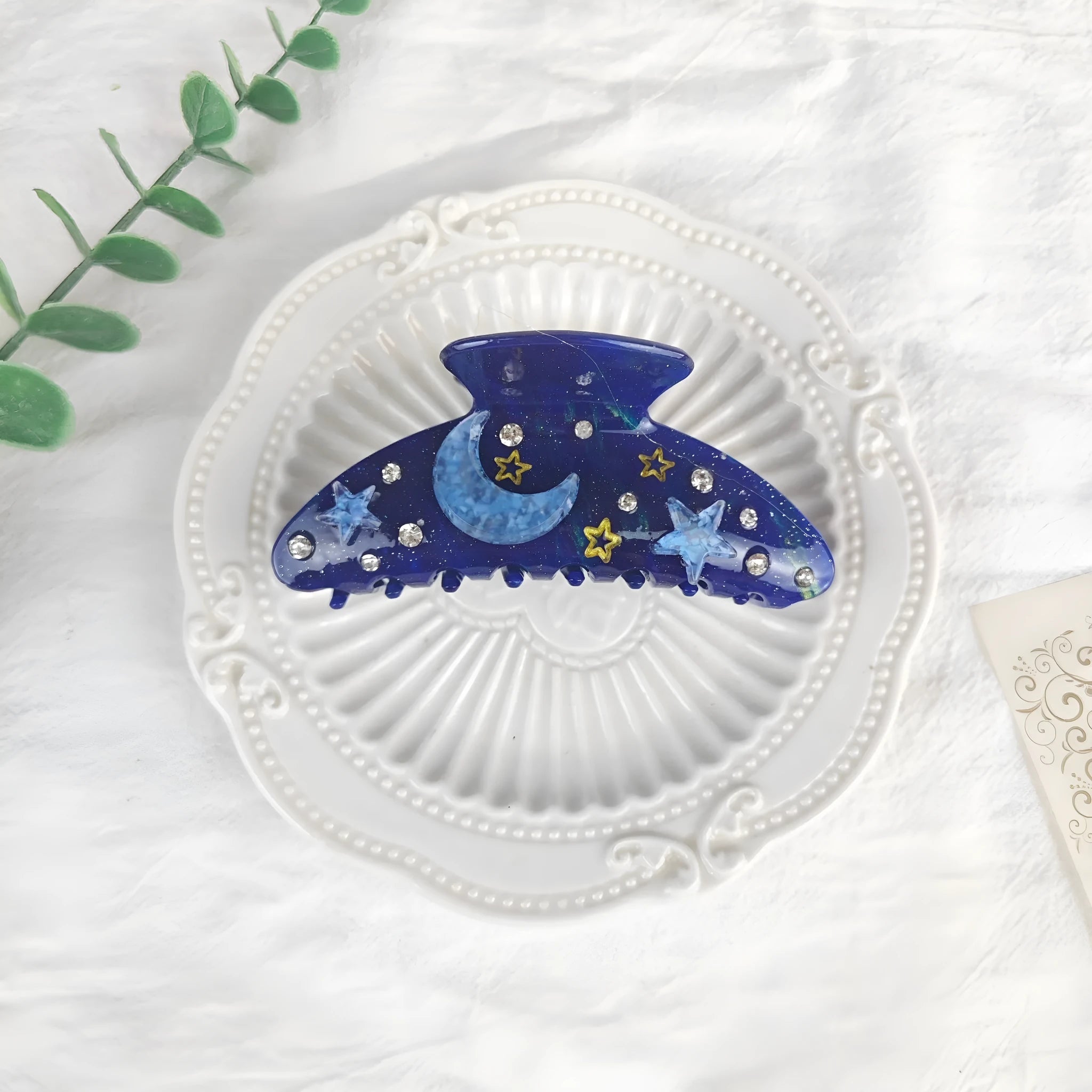 Oversized star moon barrettes with starry sky patterns in multiple colour options