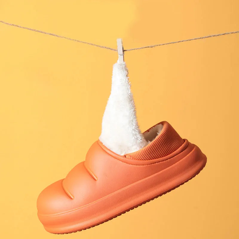 Women's winter slippers in green with plush lining and textured EVA sole, shown as sleeve-style overshoes.