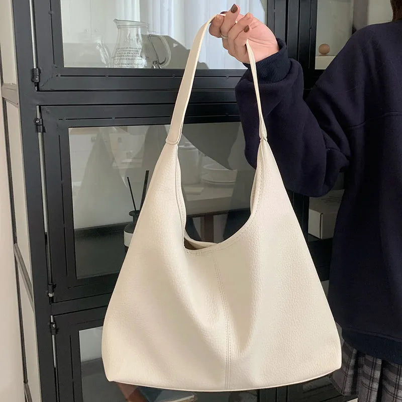 PU leather casual armpit bag for women, high capacity tote in black solid colour