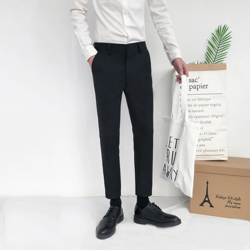 Men's slim straight-leg cotton trousers in black with a drawstring waist.