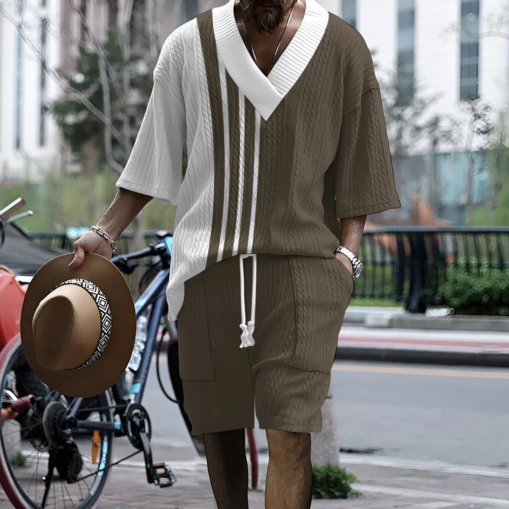 Man wearing a printed drop-shoulder short-sleeved knitted top with matching shorts.