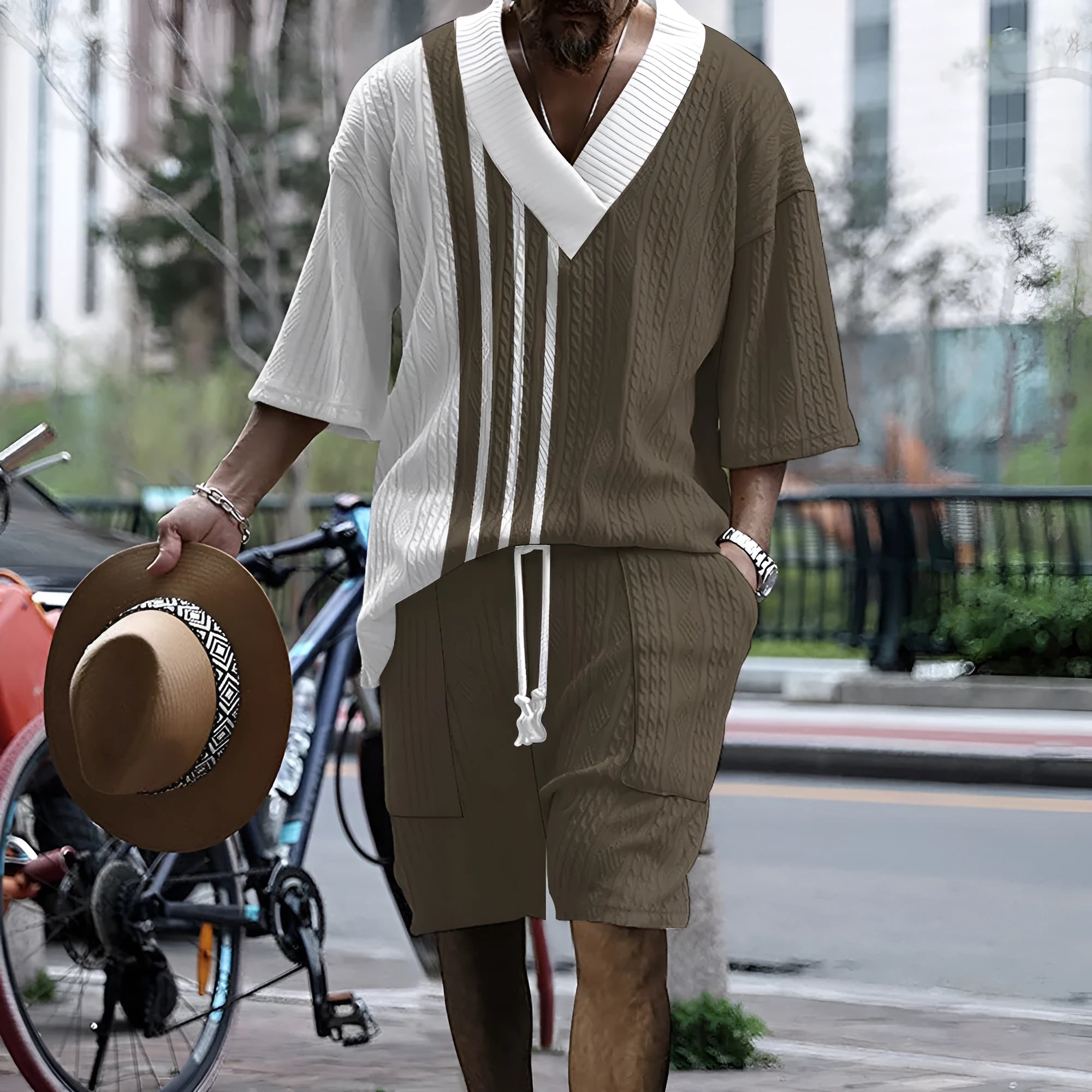 Man wearing a printed drop-shoulder short-sleeved knitted top with matching shorts.