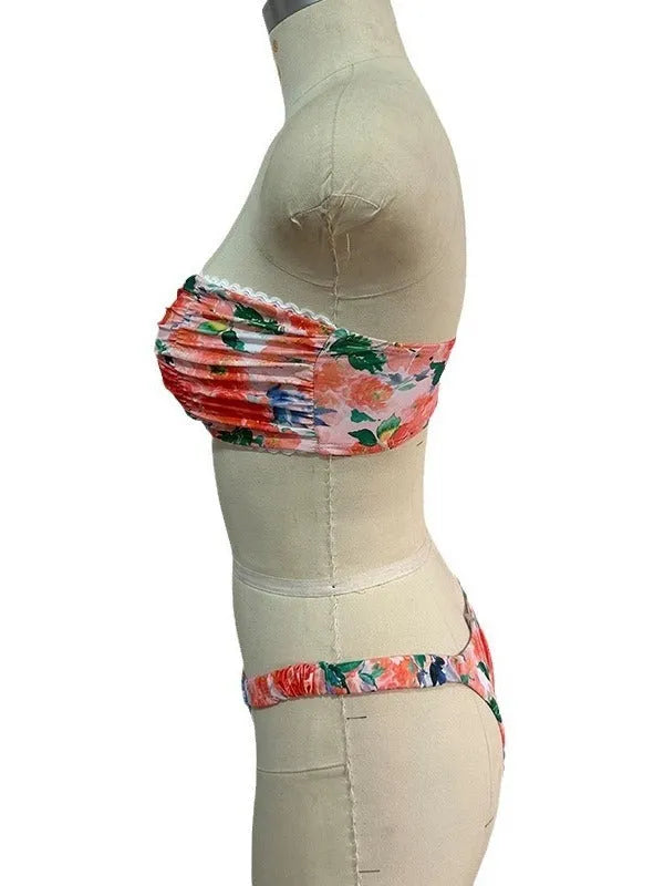 Floral printed lace bikini top in blue, shown as a sleeveless, backless tube top for swimming.