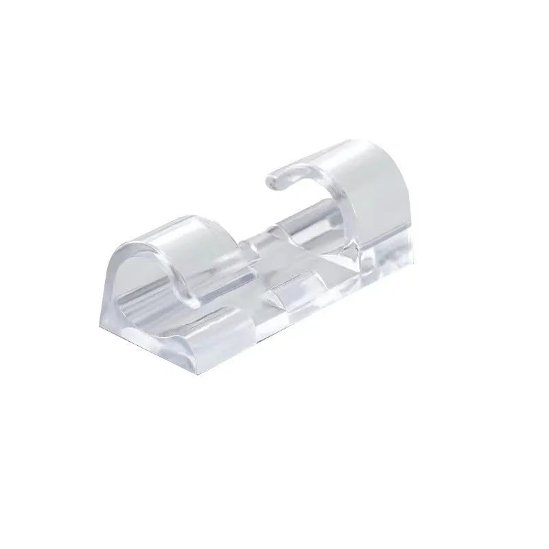 Transparent plastic self-adhesive cable management clips on a white background.