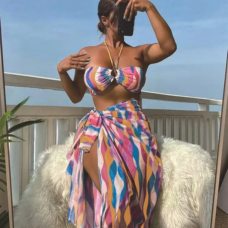 Women's three-piece split swimsuit set with top, briefs, and printed beach skirt in yellow green, magenta, or purple