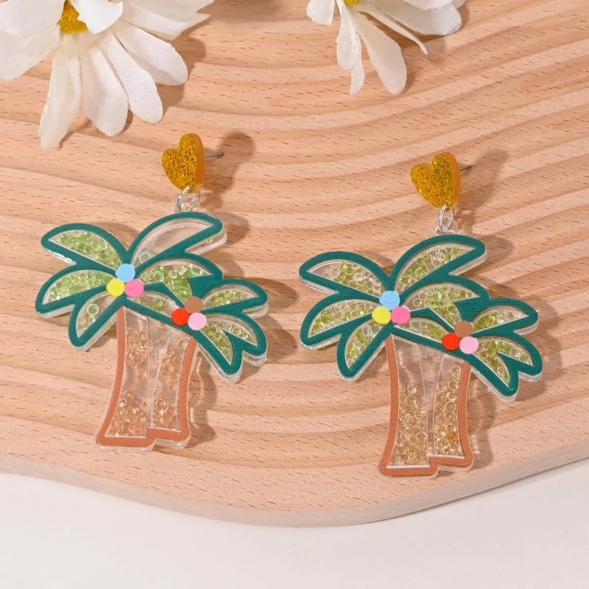 Colourful acrylic drop earrings with fruit and dessert charms including strawberry, cherry, pineapple, and watermelon.