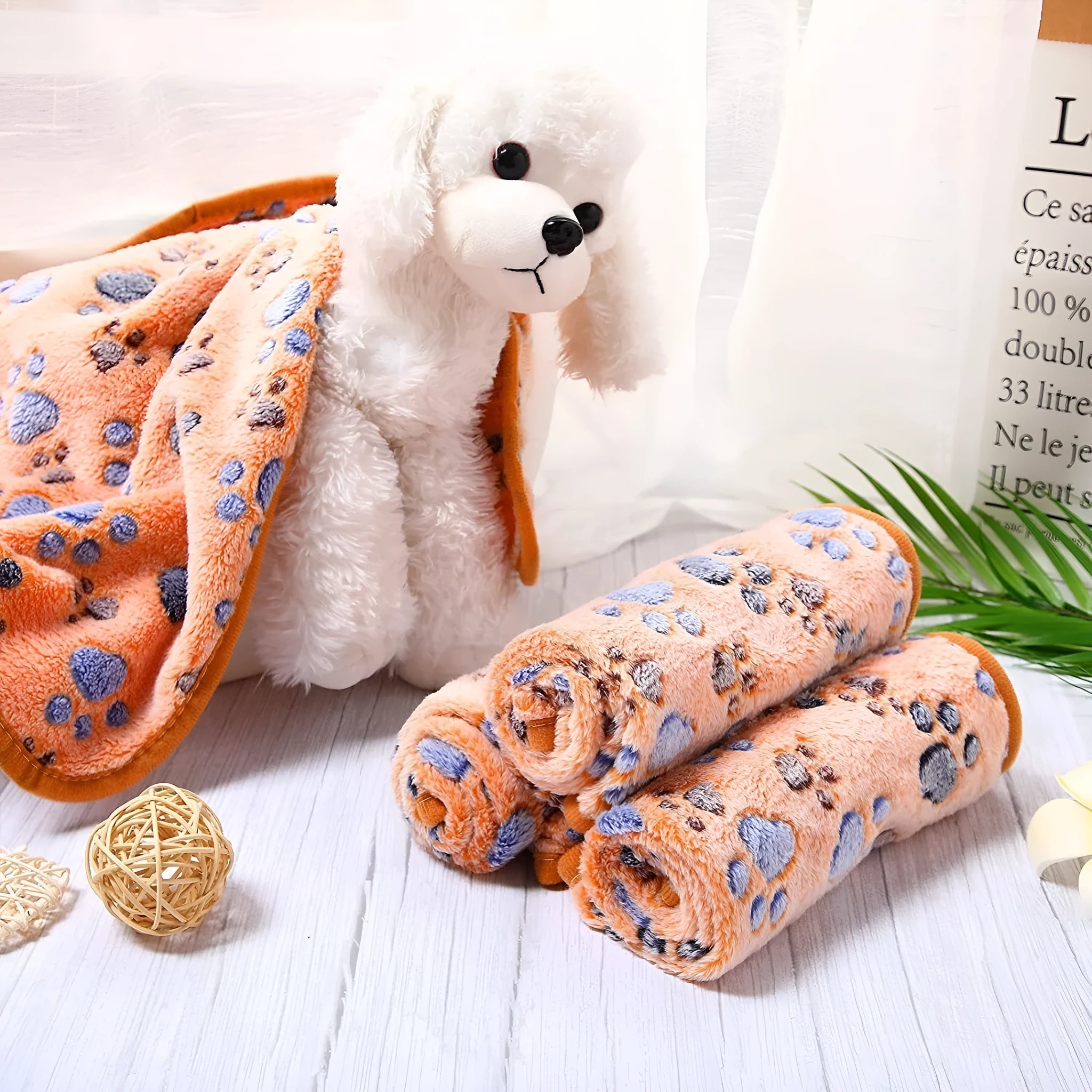 Coral fleece pet blanket with dog paw print design in multiple size options