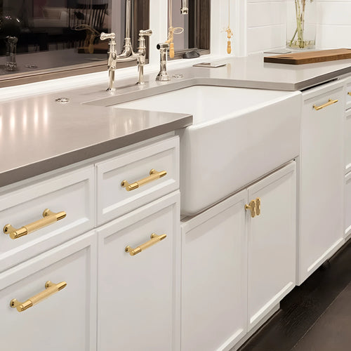 Brushed brass aluminium alloy cabinet handle with visible screw holes for mounting.