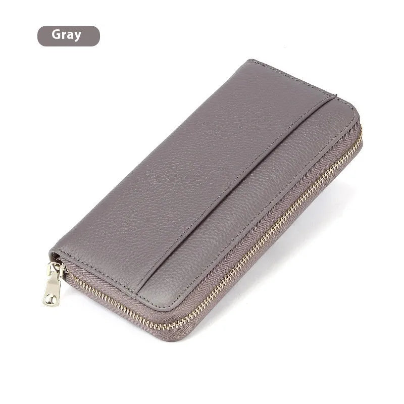 Long genuine leather women's wallet in a choice of colours, shown open to display multiple card slots and a large main compartment.