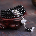 Natural black and red agate 108-bead bracelet with geometric shapes