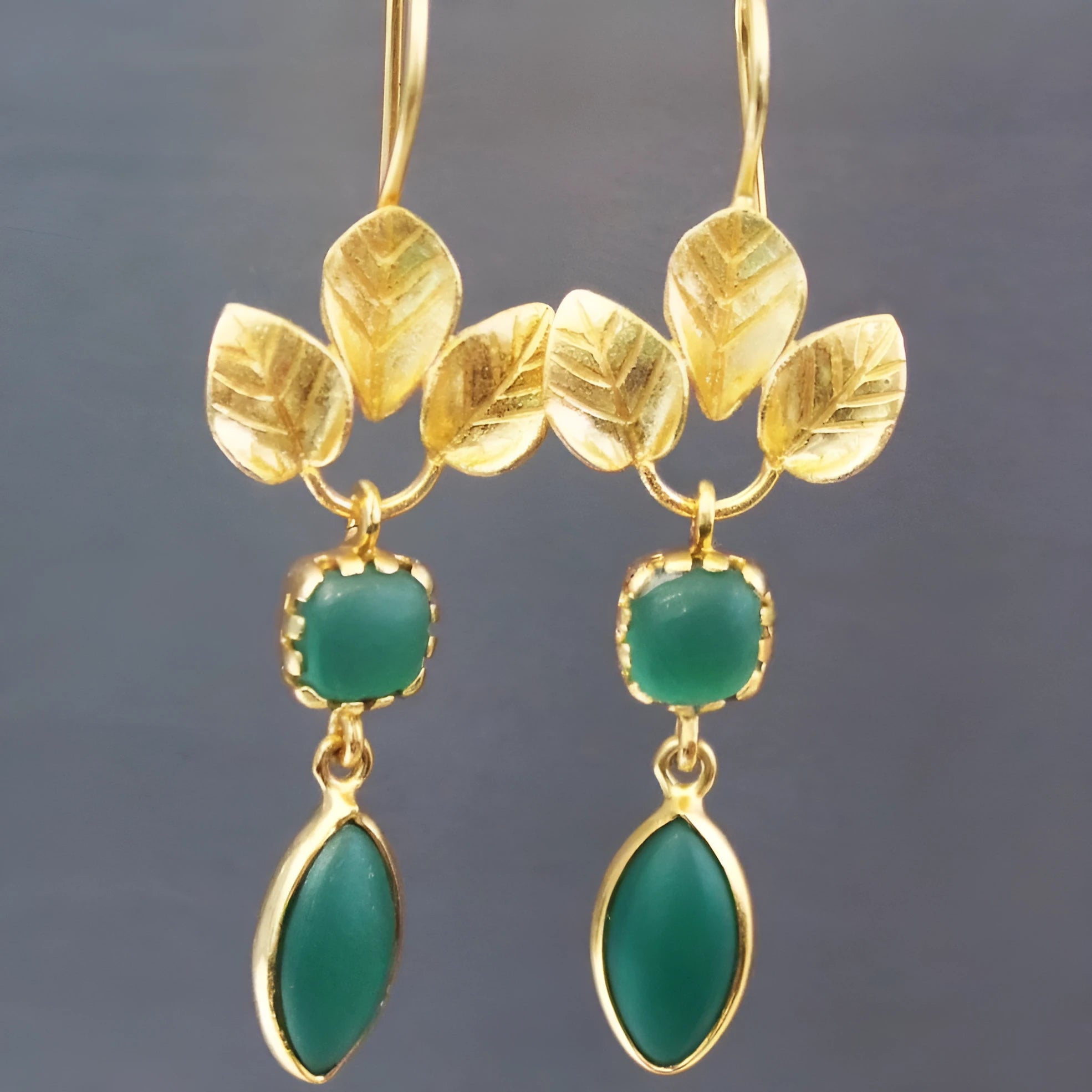Gold retro French leaves tassel earrings with water drop zircon stones in a delicate drop shape.