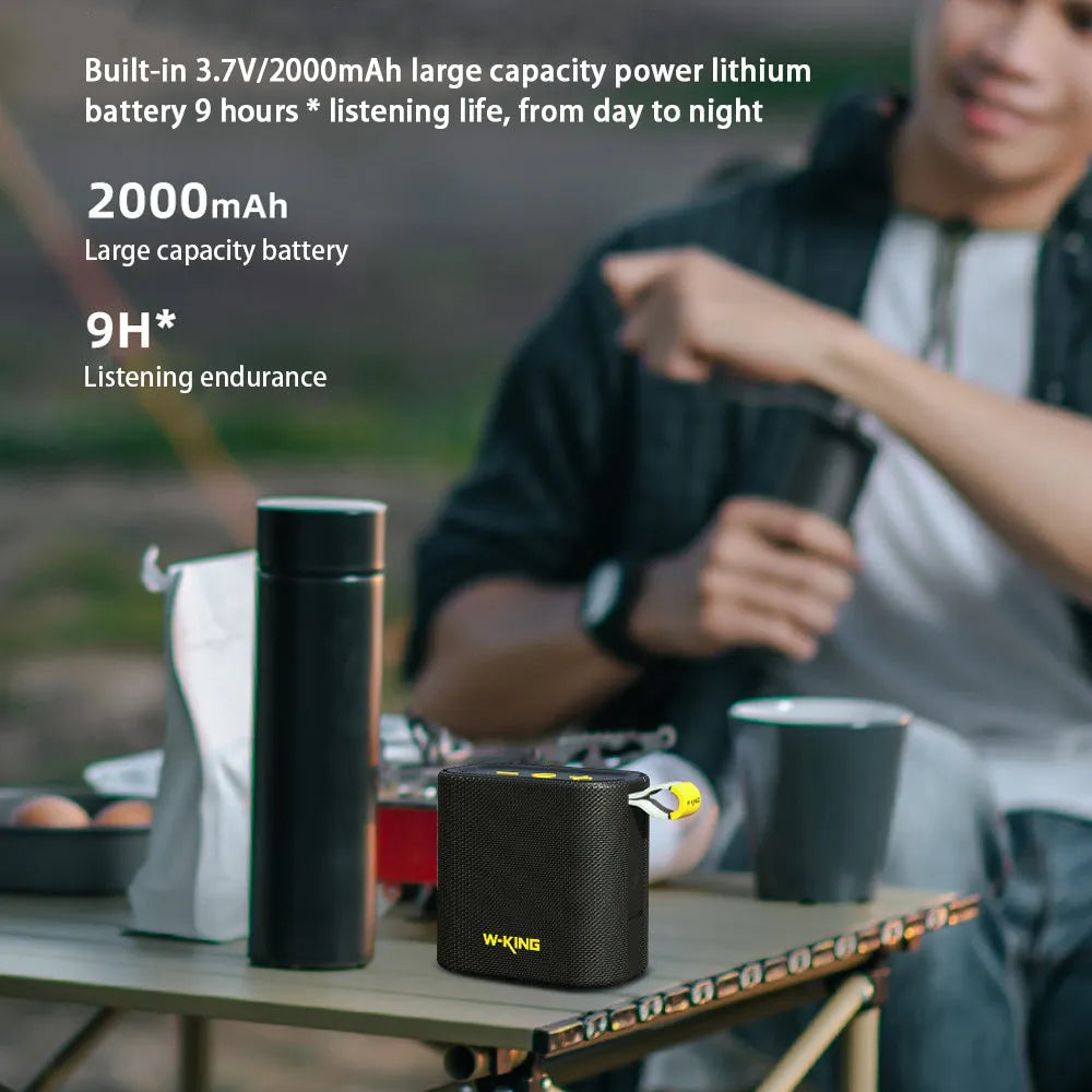 Black portable Bluetooth speaker with compact waterproof design, shown front view