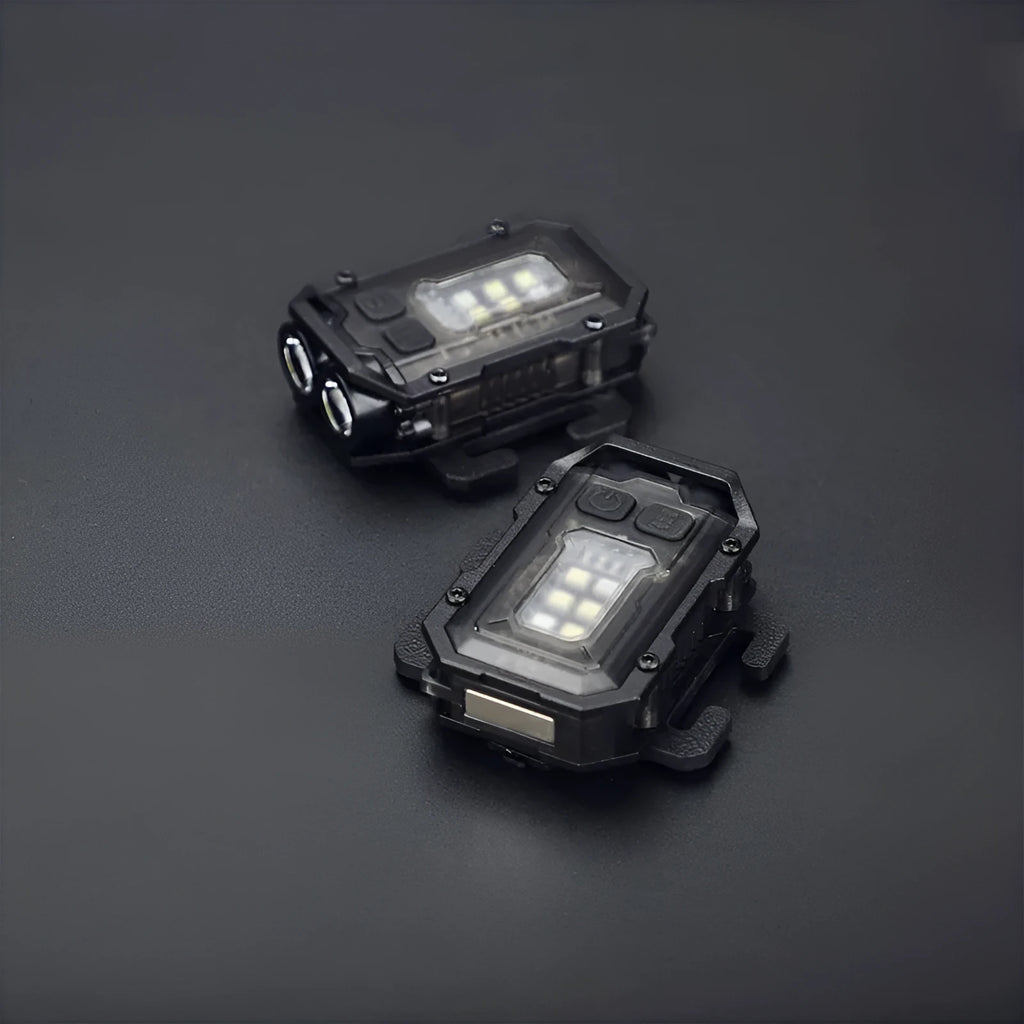 Portable tactical torch with USB cable mounted on a backpack strap.