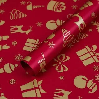 Christmas Kraft paper gift wrap sheets with red and green ink printed cartoon designs including polka dots, snowflakes, and Christmas trees
