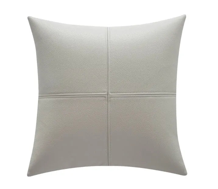 Soft cowhide leather solid colour pillow cover in a neutral shade on a sofa