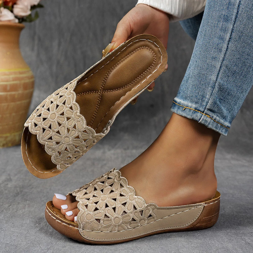 Women's wedge beach slippers with flower cutout design in four colours: black, khaki, blue, light brown