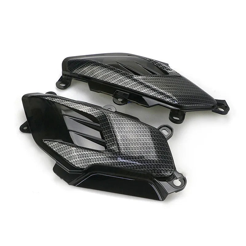 Pair of black LED side lamps for Yamaha NMAX scooter with carbon fibre decoration and clear lens.