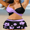 Purple women's bikini set with lace-up front and high-waisted split skirt.