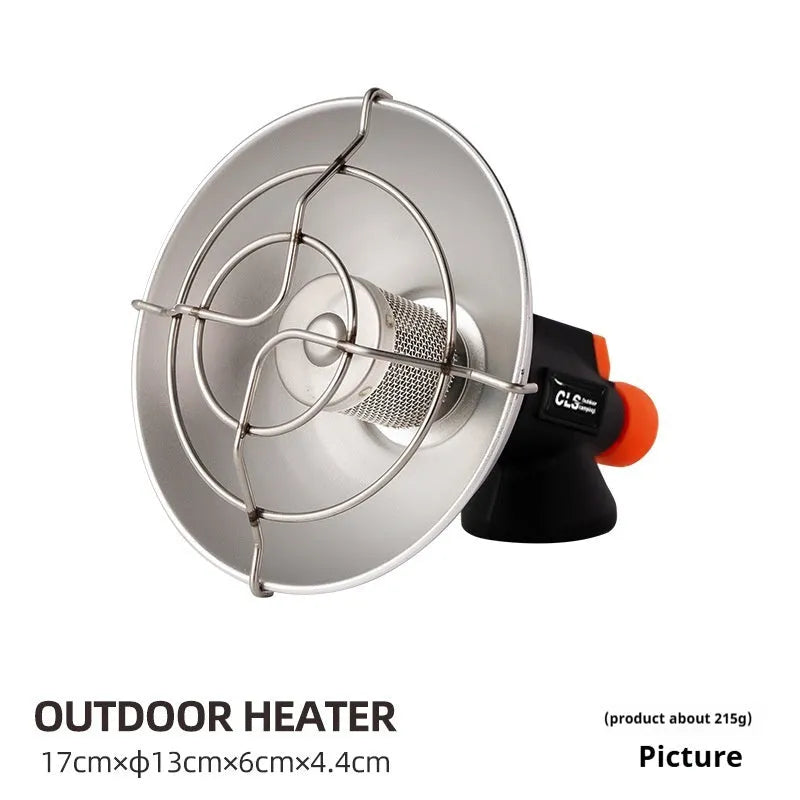 Black and orange portable outdoor heating stove with automatic ignition on a surface.
