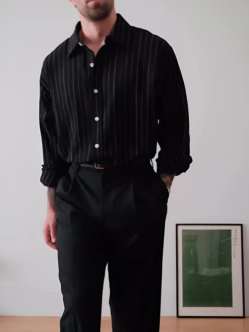 Black pinstriped polyester button-down shirt for men on a hanger, showing regular fit.