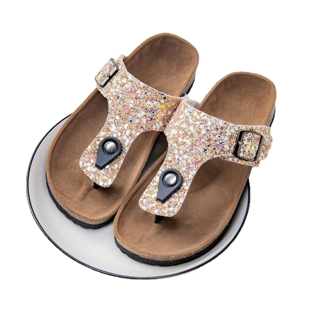 Gold frosted cork flip-flops with artificial leather upper and textured PVC sole.