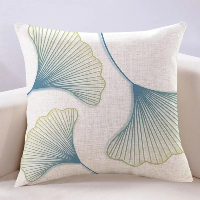 Ginkgo leaf printed square cushion cover on a sofa, available in multiple colours and sizes