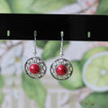 Geometric Miao silver ethnic earrings with turquoise flower disk in black, blue, or red.