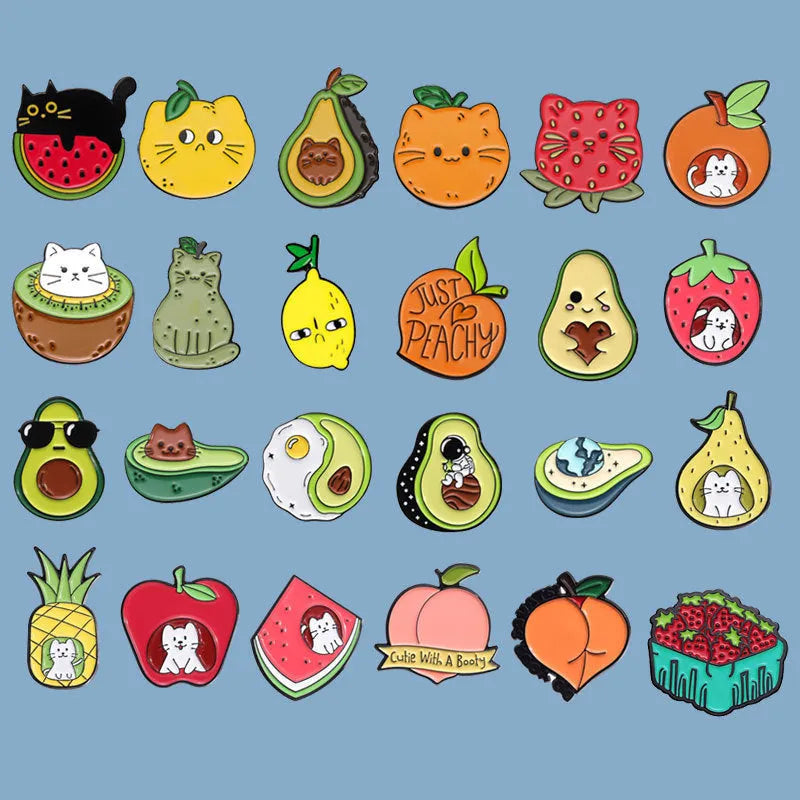 Colourful cartoon-style fruit metal brooch with a pin back on a denim jacket lapel.