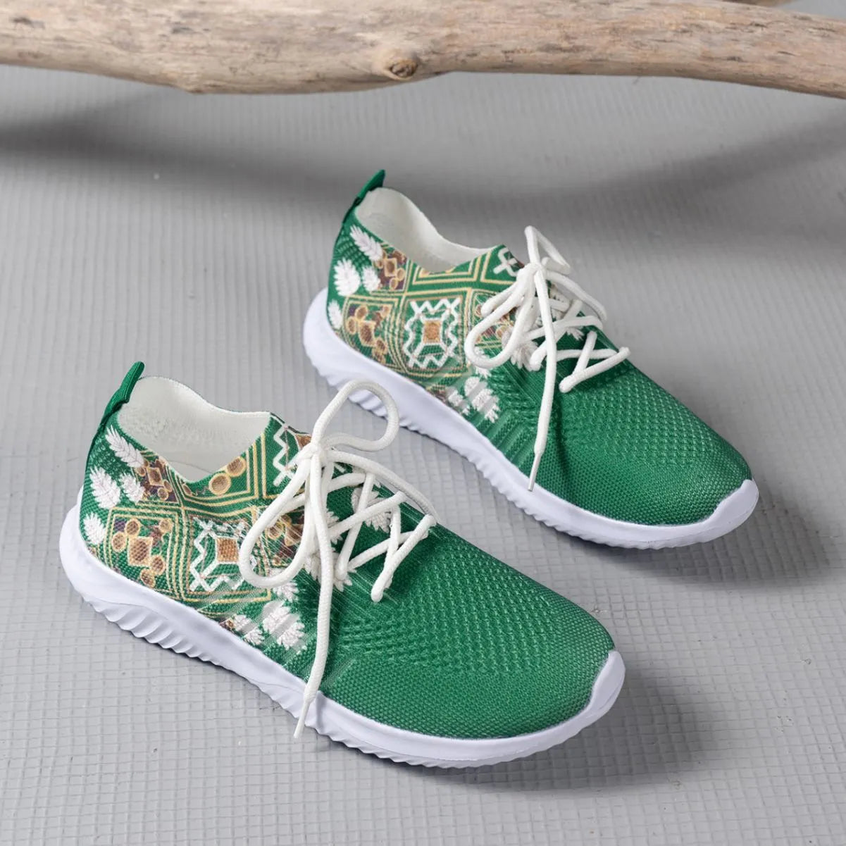 Women's woven flat casual sneakers in green with mesh upper, round toe, front lace-up, and rubber sole