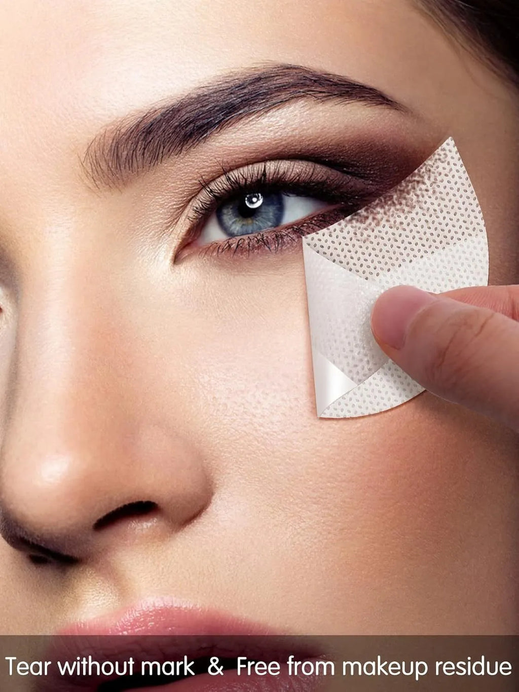 Half moon shaped disposable eyeshadow shields on a white background.