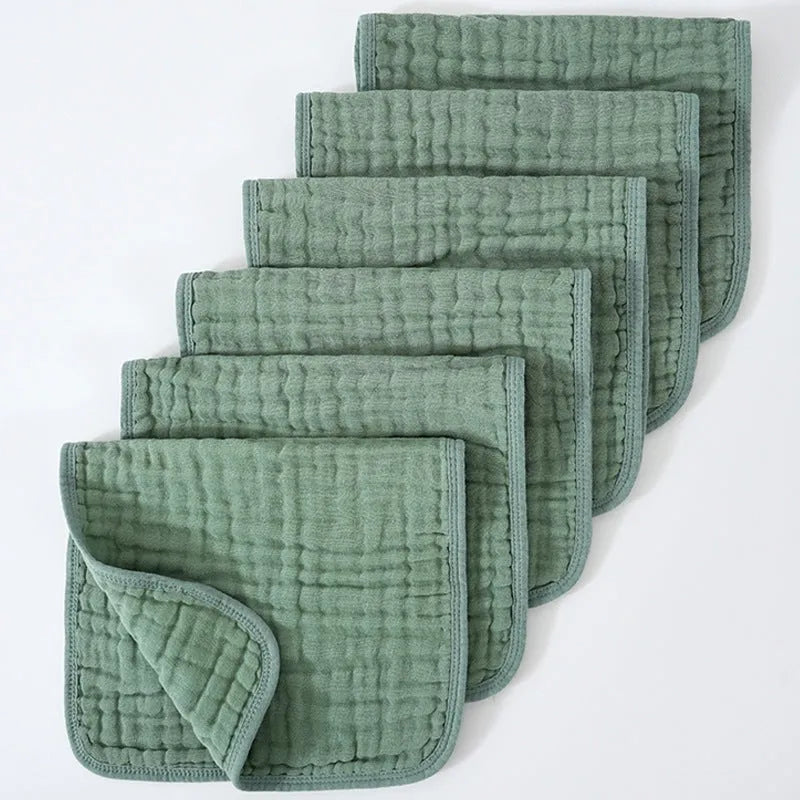 Set of six large muslin burp cloths 25x50cm in assorted colours on white background