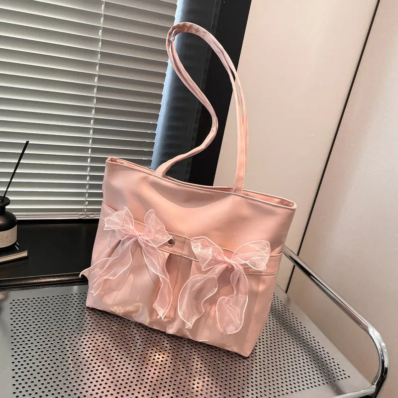College style bow tote bag in PU leather with large capacity and internal zipper pocket organisation