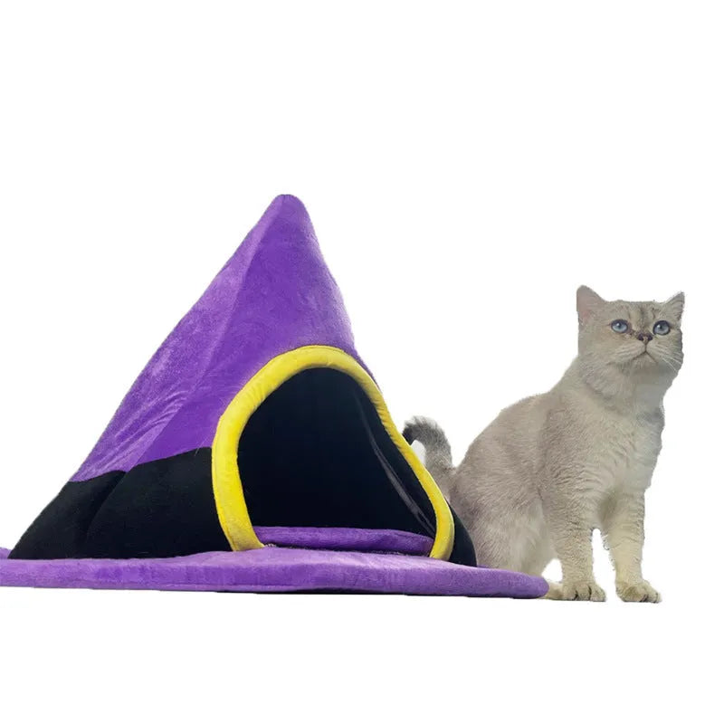 Purple Halloween witch hat shaped cat bed for pets, showing soft cloth material and enclosed design.