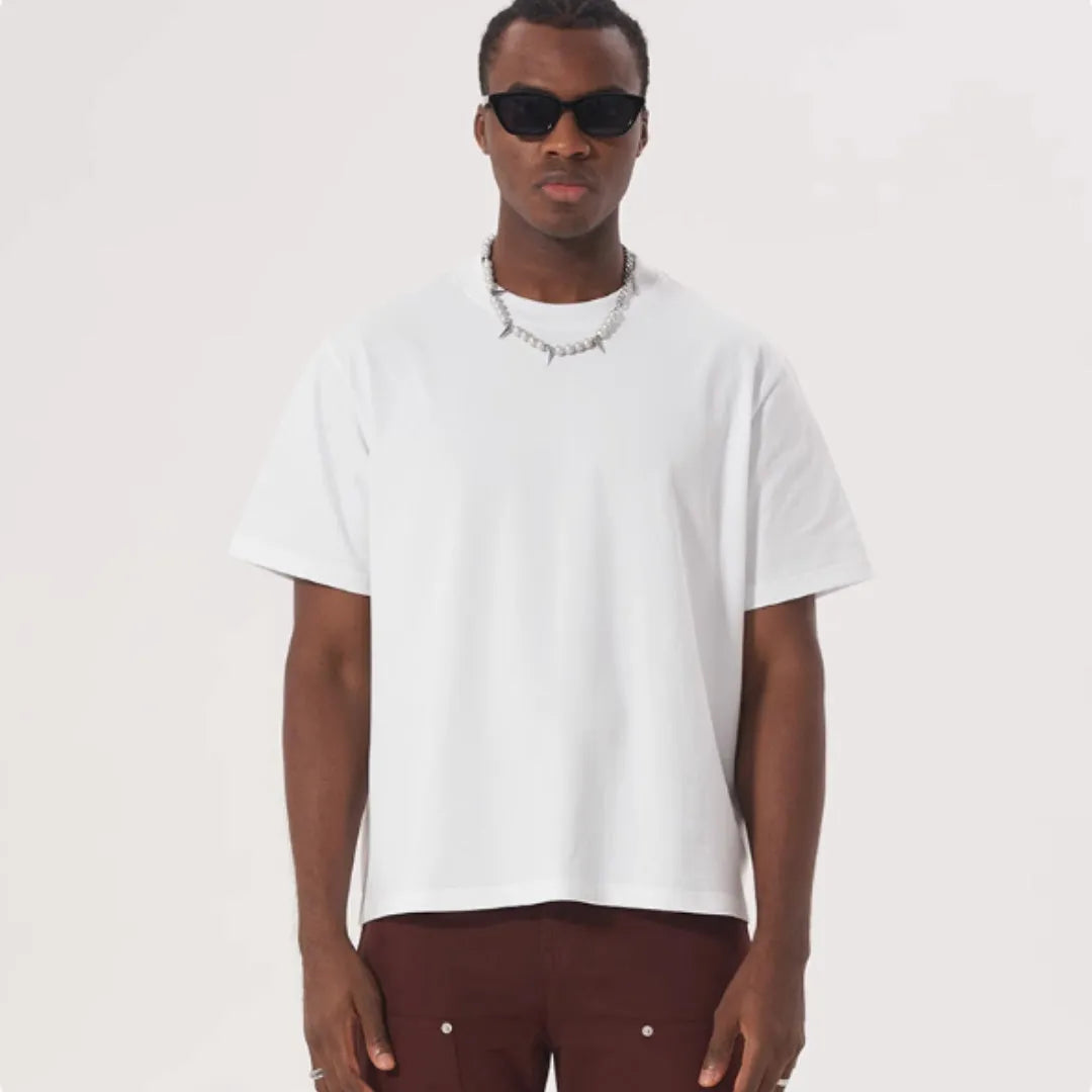 American style loose fit pure cotton T-shirt shown in apricot colour on a model.