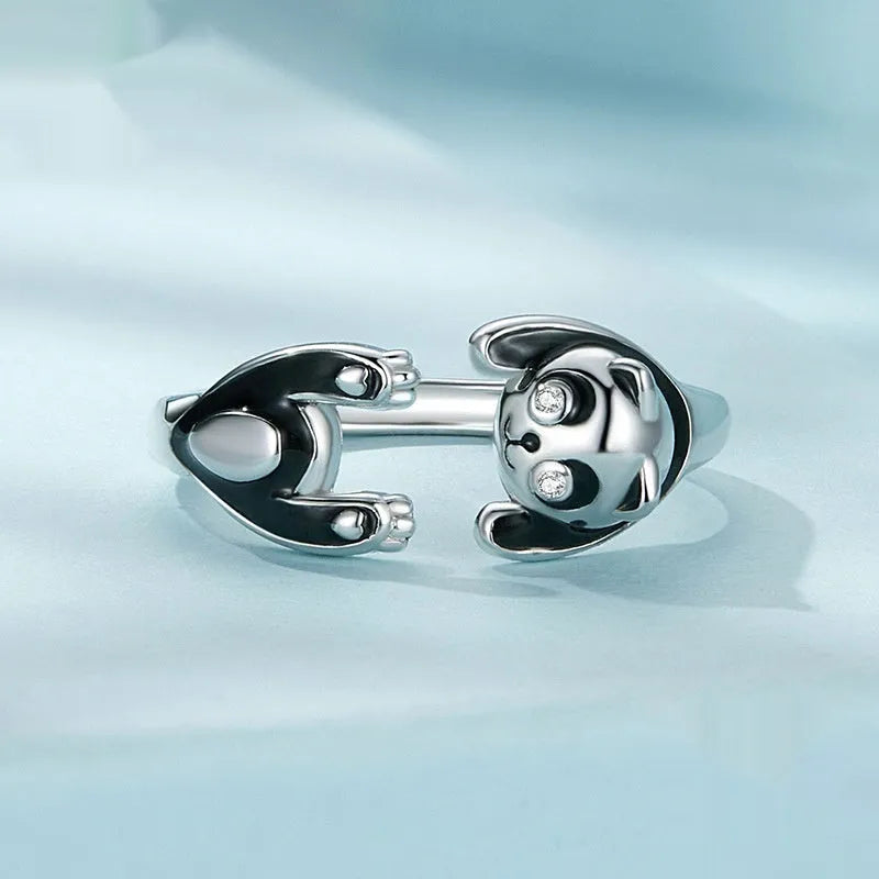 Adjustable sterling silver panda ring with white gold plating on an open band.