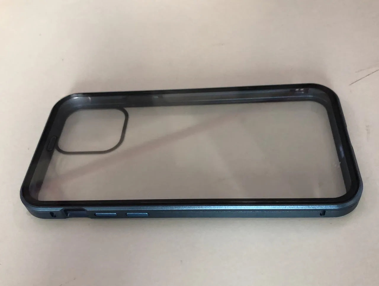 Closed black clamshell privacy case for iPhone showing front screen and sliding camera cover tabs.