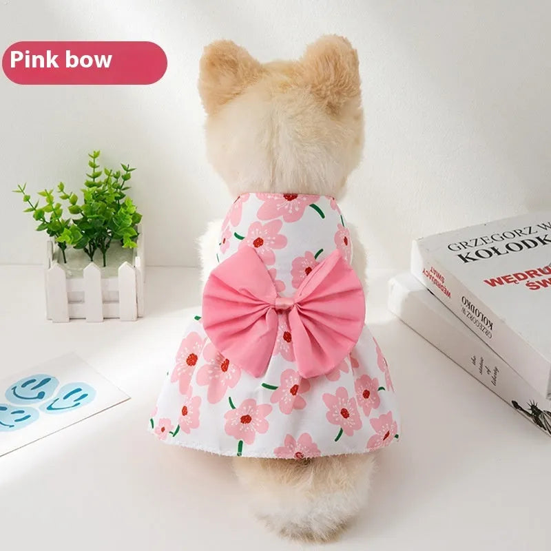 Orange bow floral butterfly pattern polyester dress on a small dog
