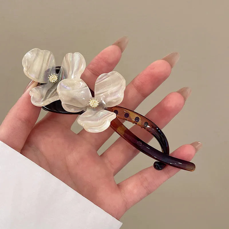 Retro flower bobby pin with acrylic petals for back head updos, available in blue, light blue, beige, or pink petals.