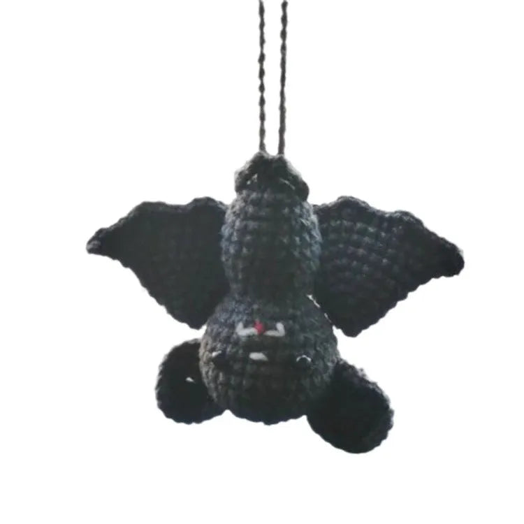 Plush hand-woven car hanging ornament in a cartoon design, made from soft polyester fabric.