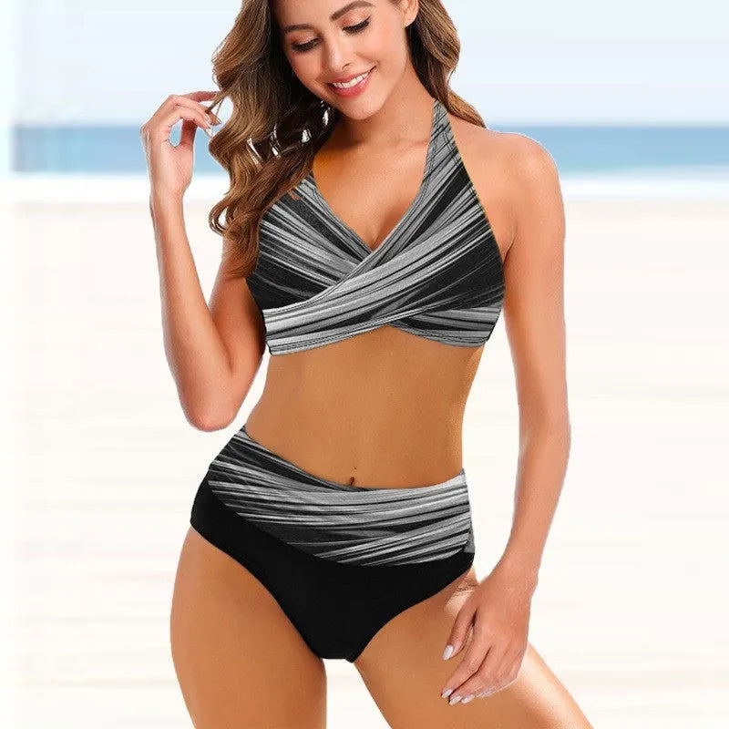 Ladies striped tie-dye hollow-out bikini with high-waisted briefs on a mannequin.
